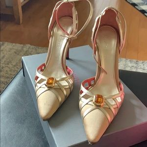 Judith Leiber satin and leather heel.